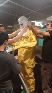 NPPTL-Ebola-HumanTestSubject2014.jpg NIOSH staff members evaluating healthcare worker protection used in the Ebola response under simulated West Africa weather conditions.