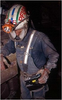 mineWorker.jpg Miner using the NIOSH developed personal dust monitor.