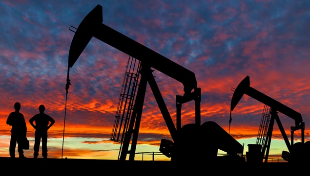fogbannerimage Silhouettes of pumpjacks and oil workers at sunset. Photo by ronniechua, Getty Images©