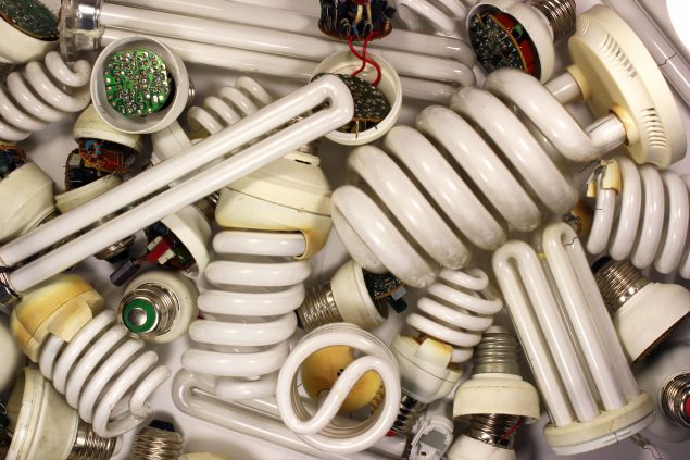 Large pile of florescent bulbs for recycling.