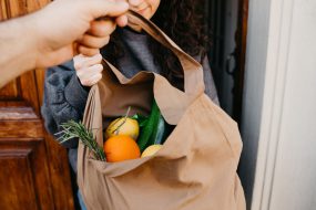 Delivering a bag of groceries