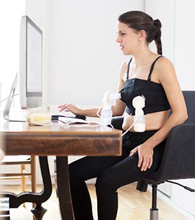 pumping-breast-milk Mother pumping milk from her breasts.