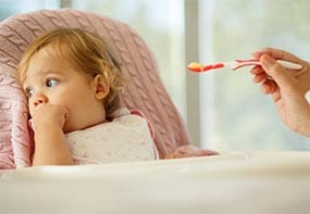 signs-hungry-full-4.jpg An 18-month old leaning away from her mother and the offered food.