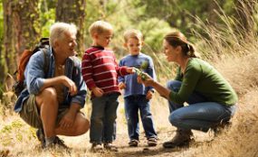 family-hiking.jpg A family hiking on a trail