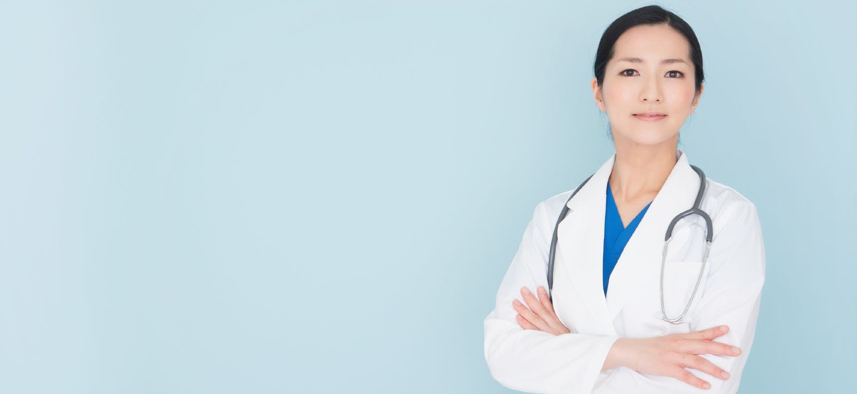 Clinician Standing Clinician standing with arms crossed.
