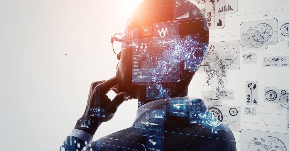 Man deeply in thought, holographically overlayed with data charts and medical scans.