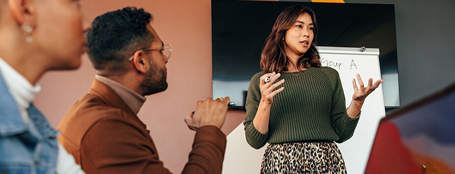 A lady presenting at an office meeting