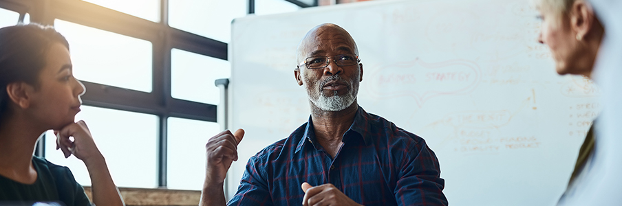 A teacher teaching Business Strategy to students
