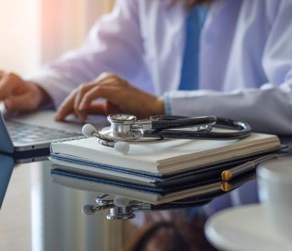 clinician using laptop clinician using laptop