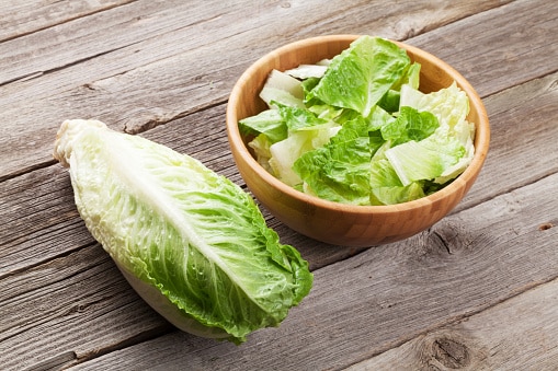 lettuce Fresh healthy romaine lettuce salad on wooden table