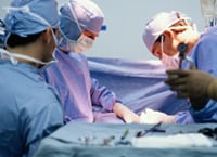 transplant Group of doctors performing surgery