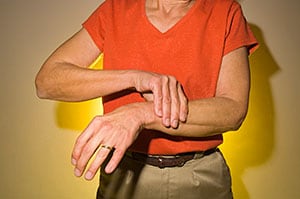 Woman holding wraist