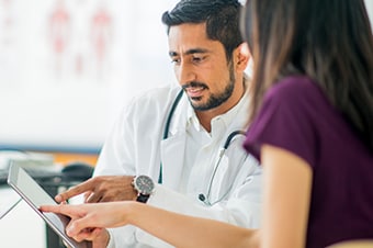 Doctor consulting with patient