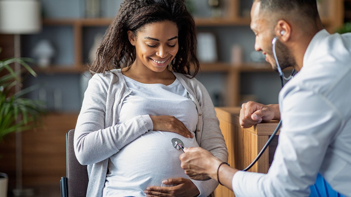 A pregnant woman visiting her doctor for a check up