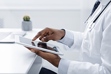 doctor with tablet