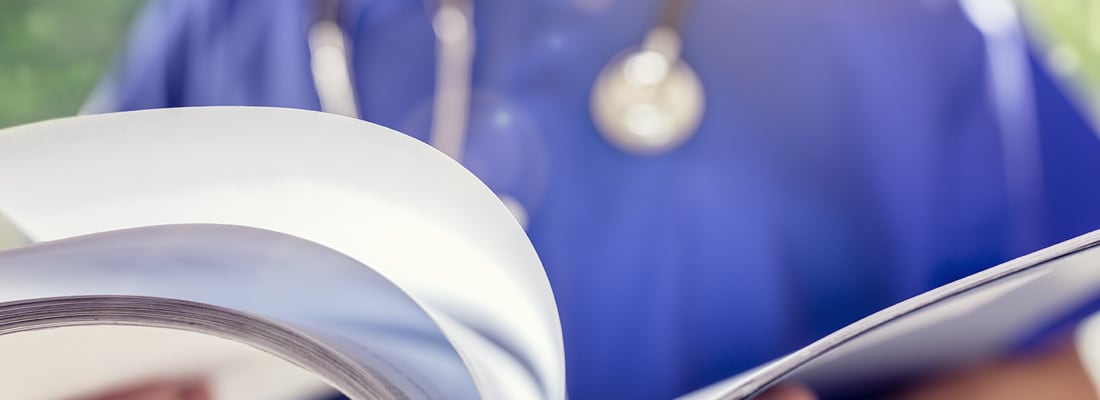 medical staff with reference document