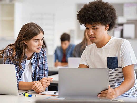 2 high school students work on a school project