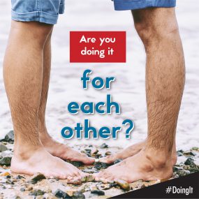 for-each-other Image displays the lower legs of two men facing each other while standing barefoot on a rocky beach, along with the following text: Are you doing it for each other?