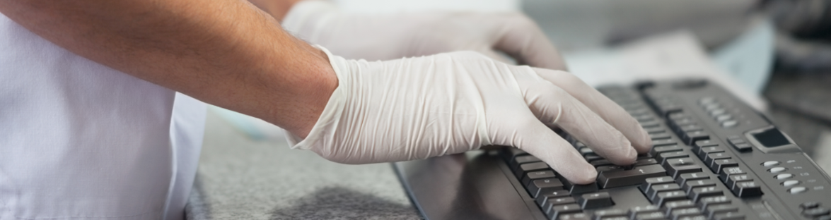 health care worker entering surveillance data