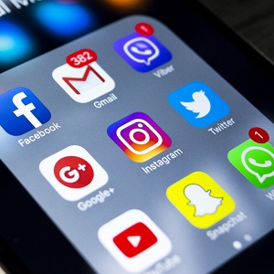 iPhone 6s plus with icons of social media on screen iPhone 6s plus with icons of social media on screen