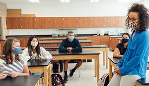 teacher with students in classroom
