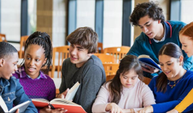 A group of teens studying together.
