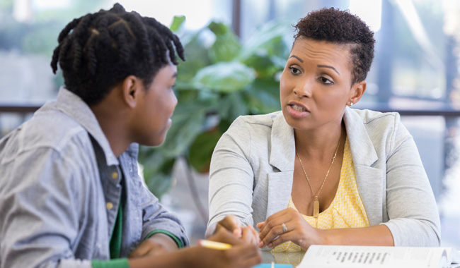 Parent talking to their teenager