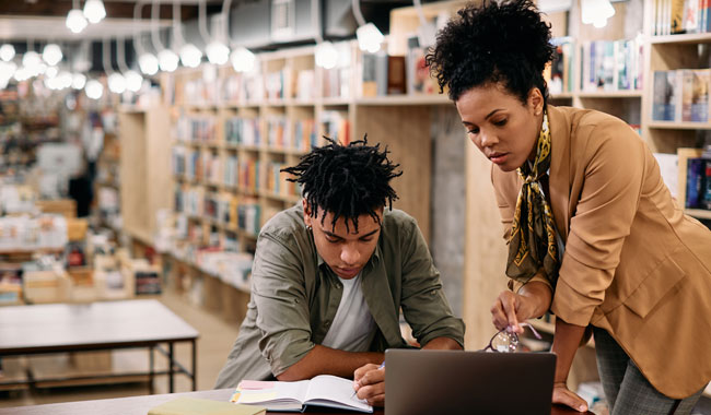 teacher talking to student