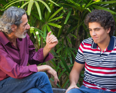 talk-to-your-child-about-e-cigarettes-3 Parent talking to his teenage son