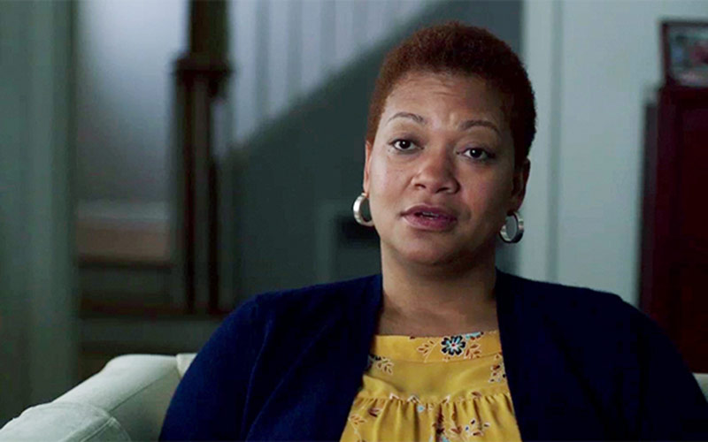 Tiffany, a Tips Campaign Participant, sits in her living room.