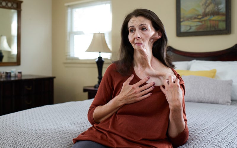 Christine sitting in bedroom