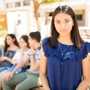 stock female teen with teens in the background