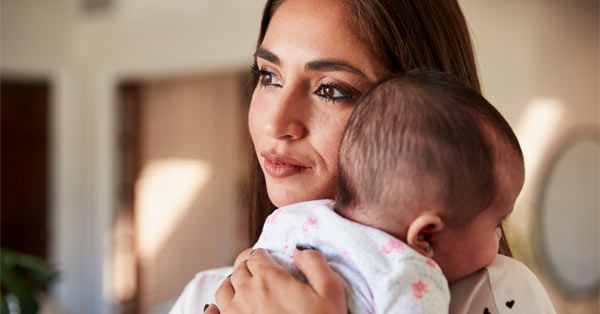 mother holding infant