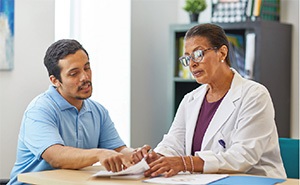 Patient consulting with doctor Patient consulting with doctor