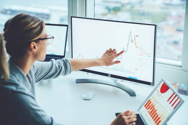 Business woman study financial market to calculate possible…