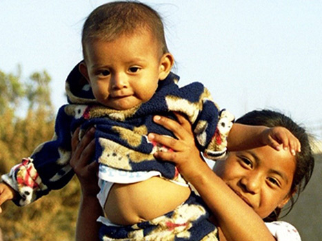 Woman holding up child