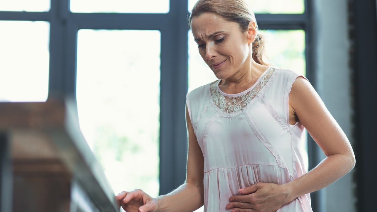 Photo of a woman with abdominal pain