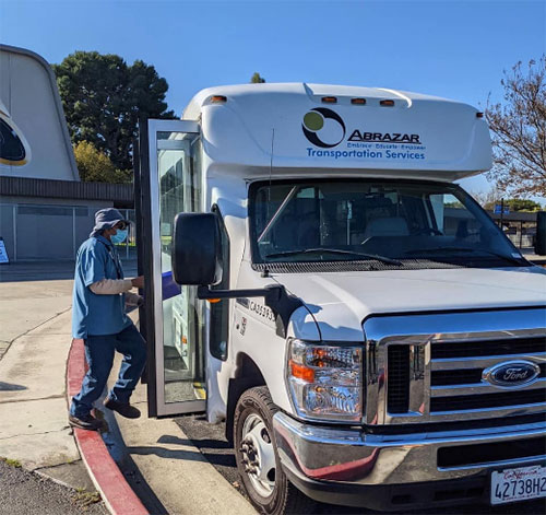 man stepping onto a bus