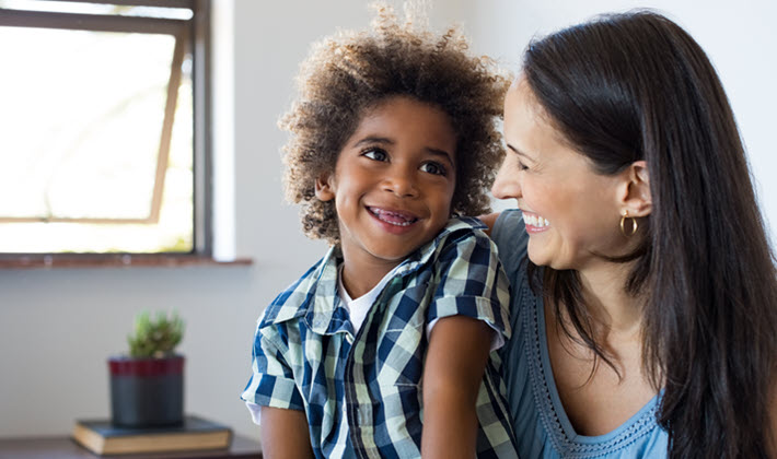 Mother holding adopted son