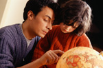 father-globe.jpg Father showing child a globe
