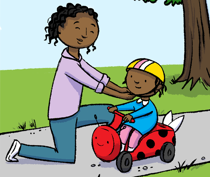 Mother placing helmet on child