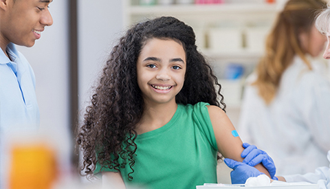 Adolescent girl smiling.