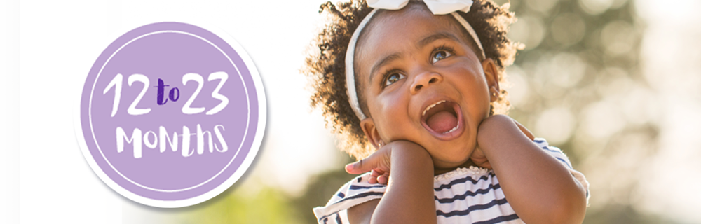 laughing infant in an outdoor setting protected by vaccines