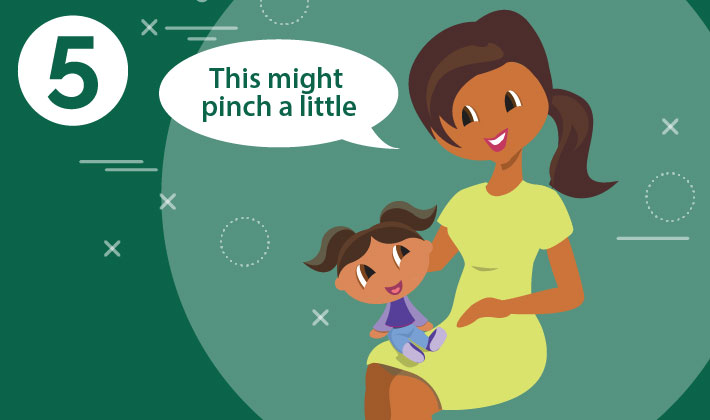 mother talking to her child sitting on her lap