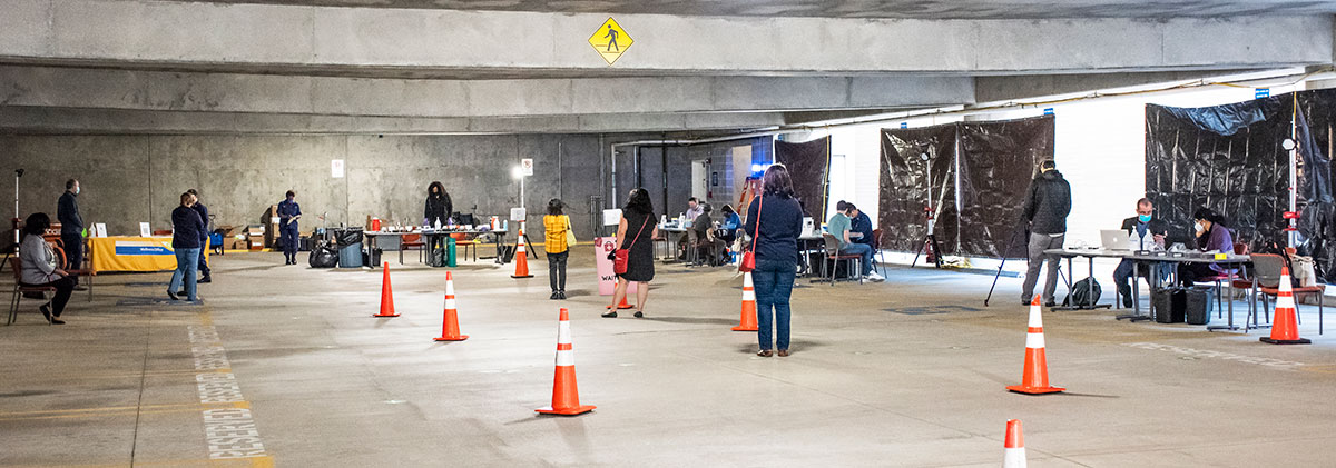 people waiting in line at a field clinic