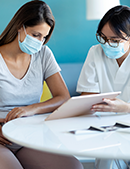 Pregnancy & Vaccines Feature 8 timing small doctor meeting with pregnant woman on vaccines and pregnancy