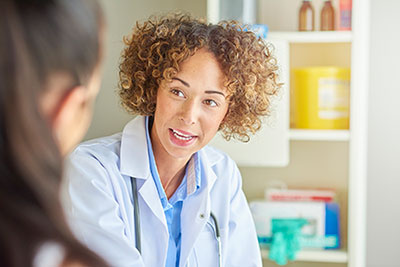 Female healthcare provider talking to patient Female healthcare provider talking to patient