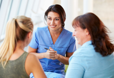 hcproviders-talking-main-image nurse talking to teenager and her mom