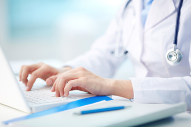 Healthcare Providers Reporting Doctor entering information online.