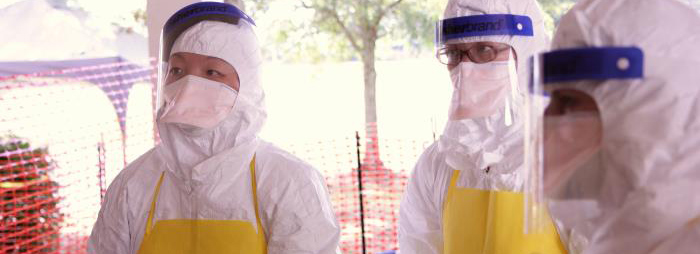 workers dressed in PPE